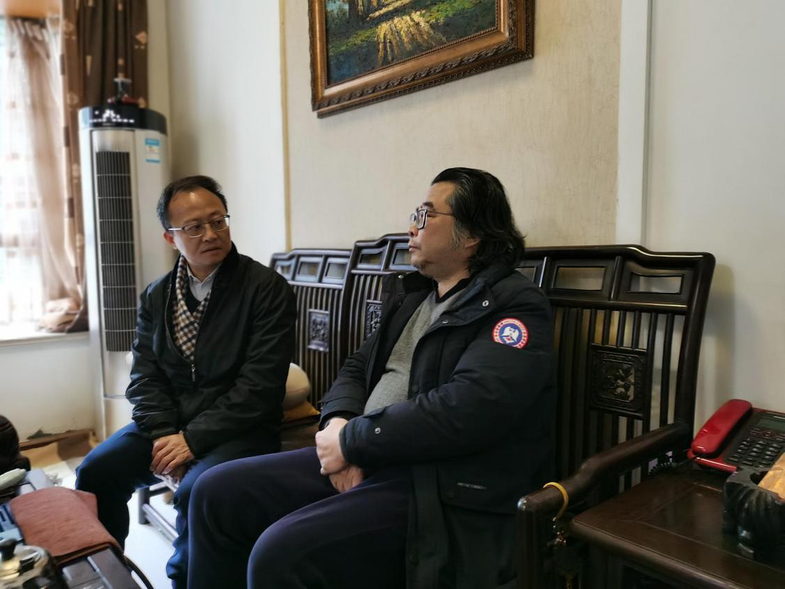 图为走访慰问照片